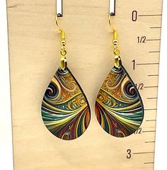 Sublimated earrings in an abstract pattern. Design on both sides of earring. Made with hypoallergenic ear wires.  Lightweight and comfy to wear. Sublimated Earrings, Abstract Pattern Design, Tucson Az, Tucson, Ear Wires, Abstract Pattern