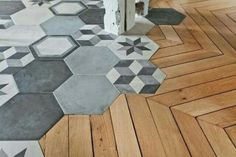 the floor is made out of wood and has hexagonal tiles on it's sides