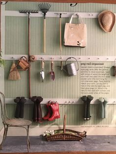 there are many different items hanging on the wall in this room, including boots and umbrellas