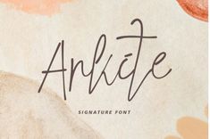 an artistic handwritten font with flowers on it