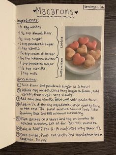 a recipe for macarons on a paper with writing in it and an image of heart - shaped cookies