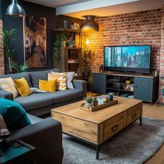 a living room filled with furniture and a flat screen tv on top of a wooden table