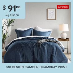 a bed with blue comforter and pillows on it for $ 19 00 reg $ 30 00