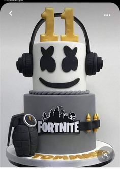 a cake that is decorated to look like a fortnite helmet with headphones on top