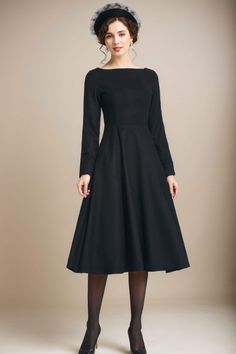 This gorgeous black fitted waist dress is perfect for the office or a night out! Wear with heels, sandals, tights or leggings and boots. Or dress it up with statement necklace and heels. This dress will fit in autumn season or winter. Details: * 35% wool blend, 35% fiber and polyester, 30% nylon * Polyester lining * Right side zipper * two side seam pockets *Midi dress, Long wool dress * boat neckline * long sleeves wool dress * A-line wool dress *Perfect for winter or autumn *Machine Washable in Warm/Cold Water/Do not bleach /Mid-iron /Hang Dry MODEL SIZE Height 170 cm (5′7″) Bust 80 cm (31.5") Waist 66 cm (26") She is wearing the black wool dress in size XS. CUSTOM ORDER Can't find your size in our size Chart Chang the Length Your Height is not Between 5'1" - 5"9" Your weight is not Betw Classic Evening Midi Dress For Winter, Black Wool Dress For Evening, Black Wool Evening Dress, Classic Black Winter Dress, Black Wool Dress For Formal Occasions, Black Wool Dress For Winter, Black Wool Winter Dress, Fitted Black Wool Dress, Black Wool Dress For Fall