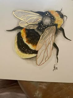 a drawing of a bee on a piece of paper