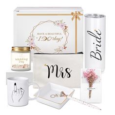 the bride gift set includes two mugs, a wedding ring, and a card