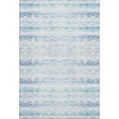 a blue and white rug with wavy waves on the bottom, in front of a white background