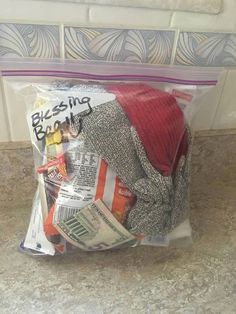 a bag filled with lots of items sitting on top of a counter