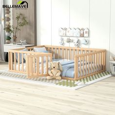 a baby crib with a teddy bear on the floor