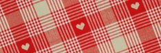 a red and white checkered fabric with hearts on the front, as well as two smaller hearts on the back