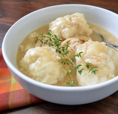 chicken and lighter than air drop dumplings in a white bowl