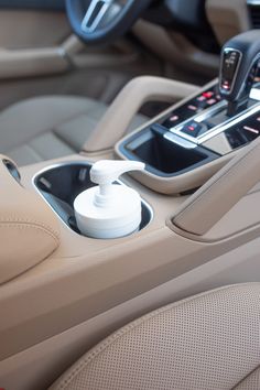 the interior of a car with an automatic soap dispenser