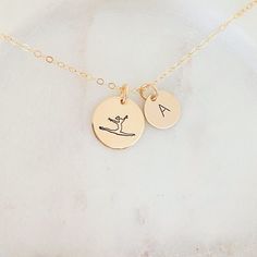 Personalised Gymnastic Necklace, Gymnastic Coach Gift, Gymnast Jewelry, Gift for Her, Sports Jewelry, Coach Gift, Gift for Girl, Little Girl ❤ Available in silver, gold and rose gold. ❤ Specification . All components are 925 Sterling Silver/ 14K Gold Filled/ 14K Rose Gold Filled . Discs size are 9mm and 12.5mm . Length includes jump ring and clasp . Comes in our signature pouch ready for gift giving ❤ More collections from StampedEve: https://www.etsy.com/au/shop/StampedEve?ref=l2-shopheader-name IMPORTANT: Usually jewellery in the pictures looks bigger than in reality. Please consider all given dimension and compare them to the ruler before ordering. ❤ About My Jewellery Each piece of jewellery of my shop is handmade and therefore unique - no two items going to look exactly alike as machi Gymnastics Jewelry, Sports Jewelry, Coach Gift, Hand Stamped Jewelry, Coach Gifts, Dec 12, Stamped Jewelry, Name Necklaces, Gifts For Girls