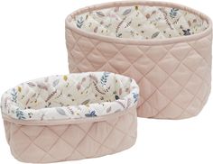 two pink quilted baskets sitting next to each other