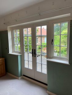 White french doors on the inside of a house with casement windows either side. Wooden French Windows, Georgian French Doors, Door With Window Above, French Doors Farmhouse, Double Casement Windows, Sliding French Doors Patio, Single Patio Door, French Casement Windows