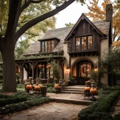 a house with pumpkins in the front yard