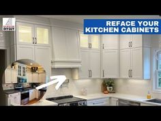 a kitchen with white cabinets and an arrow pointing to the left