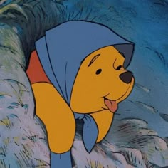 winnie the pooh is wearing a blue hat