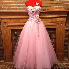 Sz2 Disney Royal Ball Gown By Alfred Angelo. Pink Folded Satin/Taffeta Bodice, Multiple Pink Sparkly Tulle Gathered Skirt Layers. Fully Lined, Built In Crinoline. Corset Bodice Closure, Zipper Skirt Closure. Front Flower Detail Could Easily Be Removed If Desired. Acrylic Gemstone Bodice Details. Has Been Professionally Cleaned, Beautiful Very Gently Used Condition. Unaltered Size And Hem. Taffeta Ball Gown For Debutante Ball During Prom Season, Prom Season Taffeta Gown For Debutante Ball, Taffeta Gown For Prom Season Debutante Ball, Taffeta Gown For Debutante Ball During Prom Season, Taffeta Dresses For Debutante Ball, Debutante Ball Gown With Ruched Bodice, Pink Gown With Ruched Bodice For Debutante Ball, Pink Ball Gown With Boned Bodice, Taffeta Gown With Sweetheart Neckline For Debutante Ball