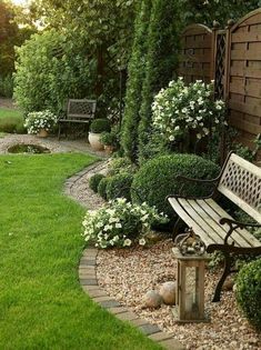 a wooden bench sitting in the middle of a garden