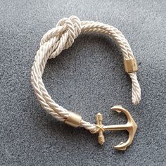 Nautical Fashion Rope Bracelet With Anchor Toggle. 8 1/2 Inches From End To End. Never Worn. Smoke Free Home. Nautical Anchor Shaped Gold Jewelry, Yellow Gold Nautical Anchor Jewelry, Blue Nautical Style Anchor Jewelry, Adjustable Navy Nautical Bracelet, Nautical Anchor-shaped Gold Jewelry, Nautical Anchor, Cord Jewelry, Anchor Bracelet, Toggle Bracelet