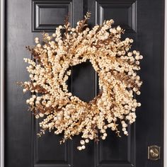 a wreath is hanging on the front door