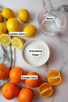 the ingredients needed to make lemon juice on a marble counter top with oranges and water