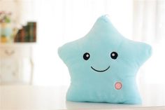 a blue star pillow sitting on top of a table