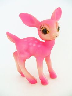 a small pink toy deer with big eyes