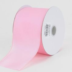 a roll of light pink satin ribbon on a white background with a barcode in the center