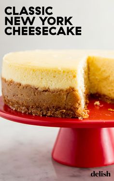 a cheesecake on a red plate with the words classic new york cheesecake