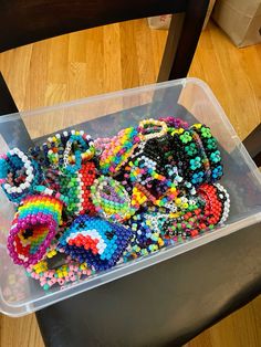 a plastic container filled with lots of colorful beads