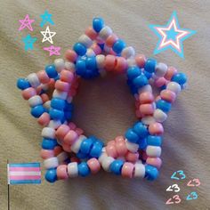 subtle trans pride 3d star kandi cuff! it's the trans flag colors but could be passed off as just pink, white, and blue. however, the pillars are the trans pride flag in order! Trans Kandi, Emo Pictures, Y2k Scene, Kandi Inspo, Trans Pride Flag, Scene Goth, Kandi Kid, Kandi Ideas, Trans Flag