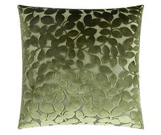 a green and black pillow on a white background