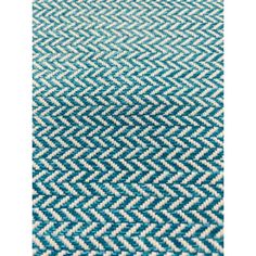 a blue and white rug with an interesting design