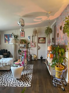 a living room filled with furniture and lots of plants