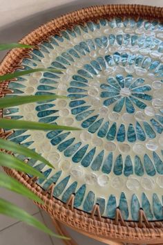 a wicker tray with blue and white designs on it