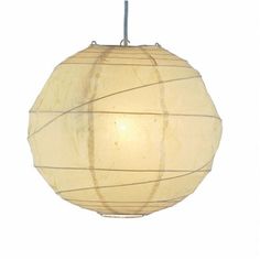 a white paper lantern hanging from a ceiling