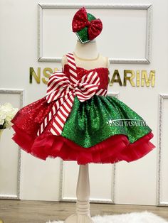 Introducing Our Enchanting Christmas Holiday Dress for Girls The magic of the holiday season comes to life with our exquisite knee-length, flared Christmas holiday dress specially designed for your little princess. Make this festive season unforgettable with this delightful creation. This Christmas holiday dress is a vision of yuletide joy, featuring a rich red and green sequined fabric. The vibrant colors, paired with its sleeveless design, ensure your child will look and feel like the belle of Green Christmas Princess Dress For Dress-up, Sleeveless Christmas Princess Dress, Sleeveless Princess Dress For Christmas, Sleeveless Christmas Princess Dress For Holiday, Sleeveless Christmas Tutu Dress, Sleeveless Christmas Holiday Princess Dress, Sleeveless Princess Dress For Christmas Holiday, Fitted Sleeveless Princess Dress For Christmas, Sleeveless Holiday Princess Dress For Festive Occasions