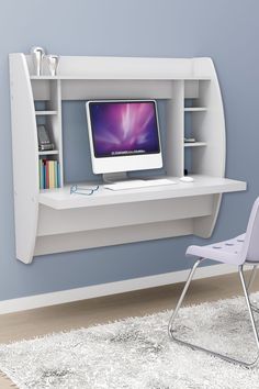 a white desk with a computer on it