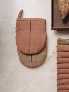 a piece of bread sitting on top of a wooden cutting board next to a bag