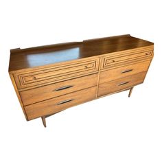 a large wooden dresser with drawers on it