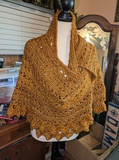 This beautiful handmade crochet shawl/wrap is a must-have accessory for any fashion-forward woman. The stunning gold color adds a touch of elegance to any outfit, making it perfect for both casual and formal occasions. Crafted with care and attention to detail, this shawl/wrap is made to last and will surely become a cherished addition to your wardrobe. Whether you're looking to elevate your outfit or simply want to stay stylish and comfortable, this handmade crochet shawl/wrap is the perfect ch Gold Shawl For Fall, Bohemian Gold Shawl Scarves, Crochet Shawl Wrap, Gold Scarf, Crochet Shawls And Wraps, Outfit Making, Shawl Wrap, Crochet Shawl, Crochet Designs