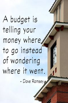 a clock tower with a quote on it that says, a budget is telling your money where to go instead of wondering where it went