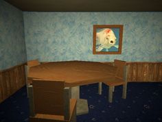 a table and chairs in a room with blue walls