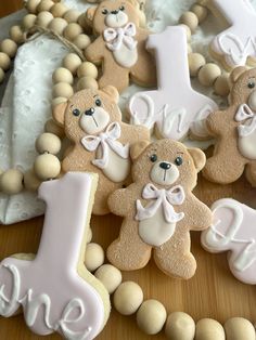 some cookies are decorated with teddy bears and the first one is for each child's first birthday