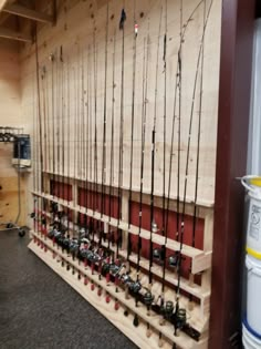 the fishing rods are lined up against the wall