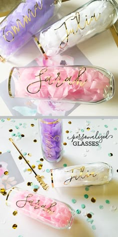 three bottles filled with pink and purple confetti on top of a white table