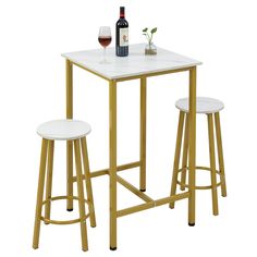 a table with two stools and a bottle of wine on the top, against a white background